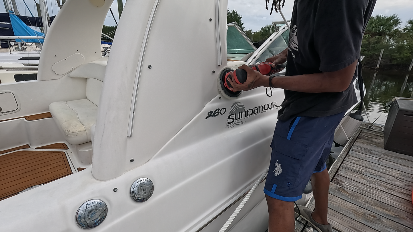 In-action shot of polishing the boat’s hull, using a Rupes rotary to achieve a flawless, glossy finish.