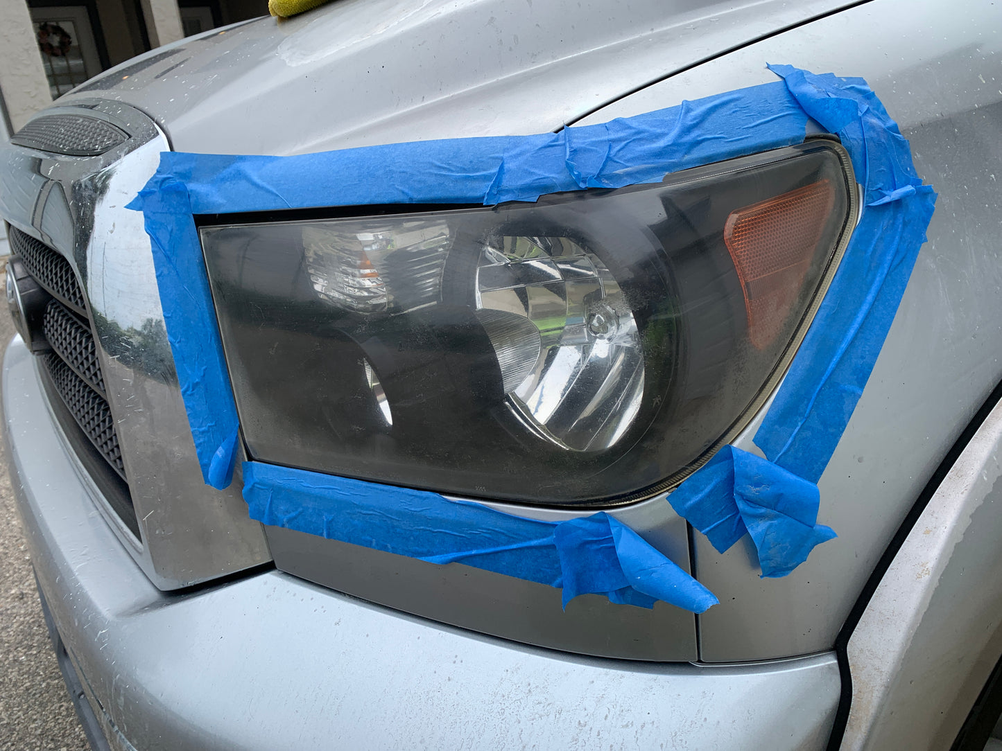 Headlight restoration after treatment showing clear, shiny headlights with improved visibility.