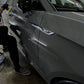 Technician polishing the Audi S5’s paint, demonstrating the meticulous process of restoring a flawless surface through paint correction.