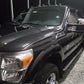 Black Ford Power Stroke after our two-step paint correction, ceramic coating, and headlight restoration, looking brand new.