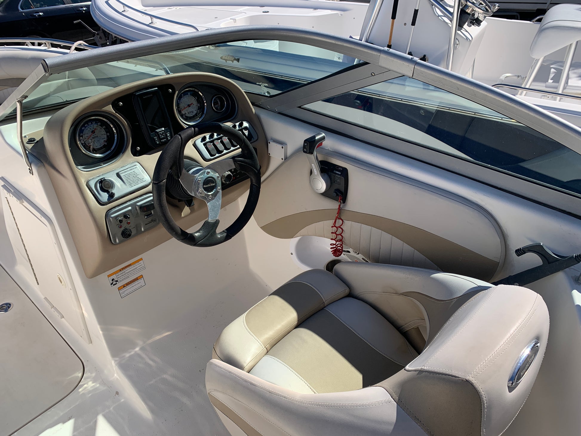 Close-up of the captain’s seating area after detailing, showing clean upholstery and polished surfaces for a refreshed look.