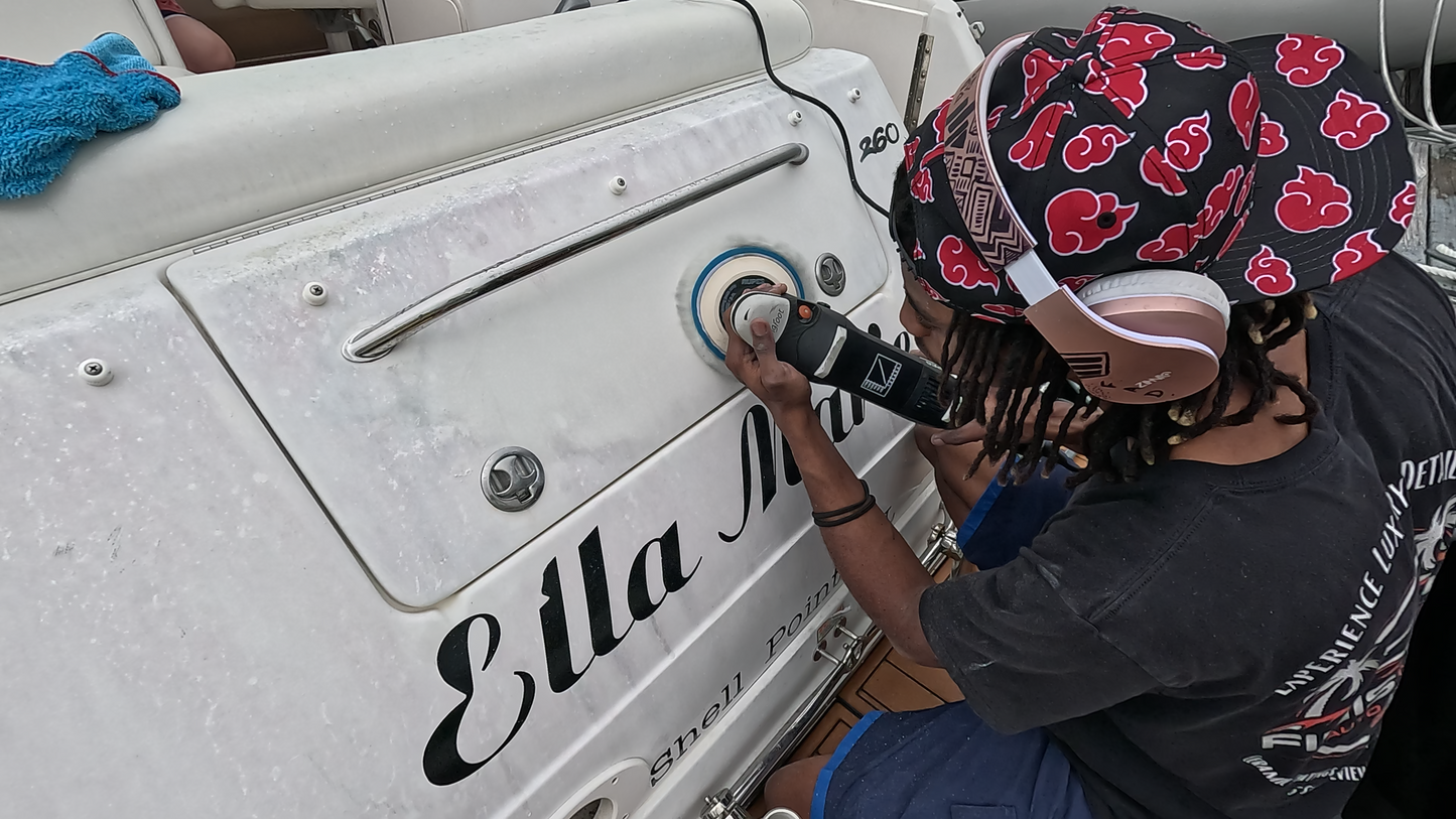 Using a Rupes rotary to polish a boat’s surface and eliminate oxidation, leaving a flawless, reflective finish