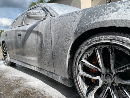 Close-up of our foam bath, lifting dirt and grime to prepare the vehicle for a deeper clean during the detailing process.