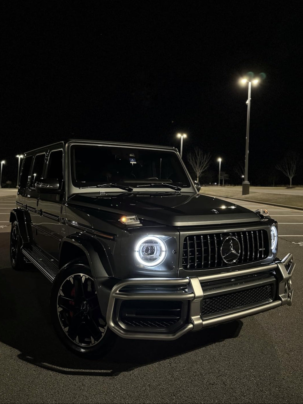 Mercedes G-Wagon parked in a lot, showcasing a glossy finish after paint correction and graphene ceramic coating.