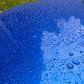 Close-up of graphene ceramic coating showcasing water beading on a vehicle surface.