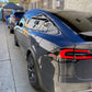 Tesla Model 3 with graphene ceramic coating applied, showing a glossy, water-resistant finish.