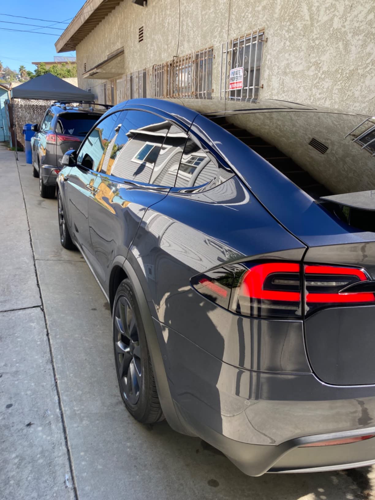 Tesla Model 3 with graphene ceramic coating applied, showing a glossy, water-resistant finish.