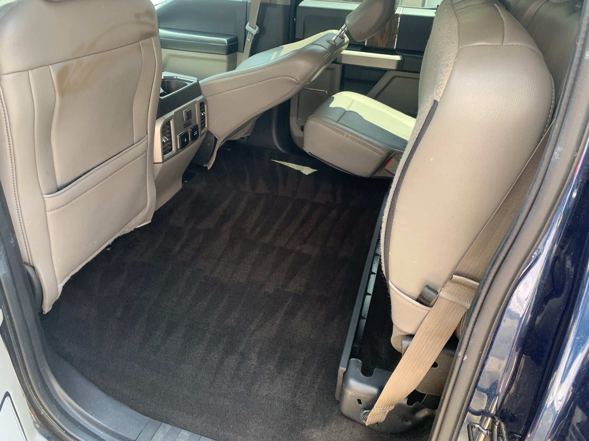 Line art patterns in a vehicle’s carpet after professional detailing, showcasing meticulous cleaning and attention to detail
