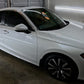 Exterior of the vehicle after paint correction, graphene ceramic coating, and window tinting, showcasing a flawless, glossy finish with the dark tint reflecting off the white surface