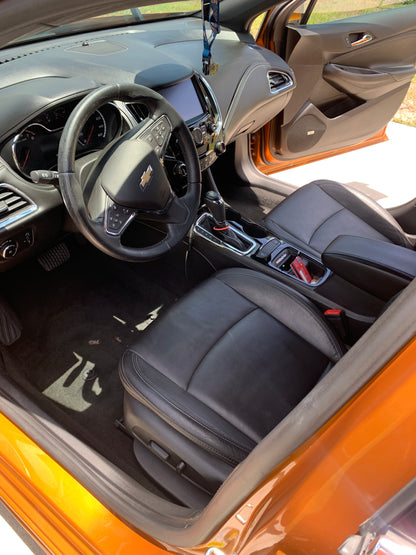 View from outside the driver's door looking in, showing the cleaned and coated interior after detailing.