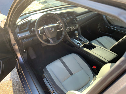 Honda interior after a deep clean, with the dashboard and center console looking brand new and refreshed.