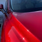 Close-up of the red Lexus R350 SUV's paint, showing paint sparkling after our two-stage paint correction and graphene ceramic coating.
