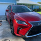 Red Lexus RX 350 after our two-stage paint correction and graphene ceramic coating, showcasing a glossy and smooth finish.