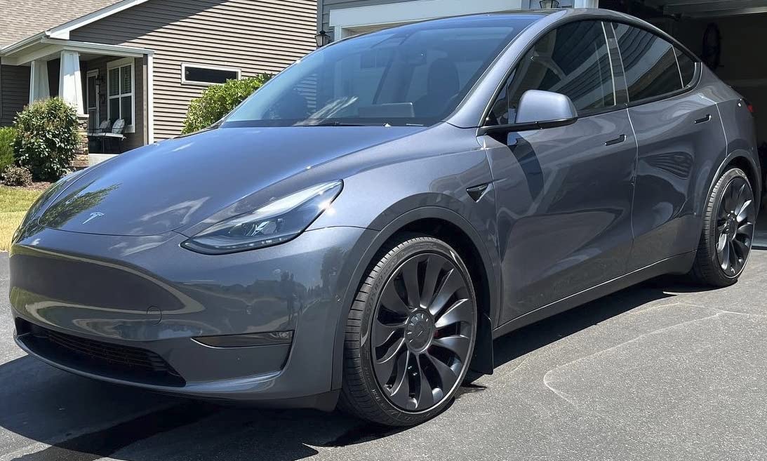 Tesla after a 2-stage paint correction and graphene ceramic coating, showcasing a glossy and smooth finish.