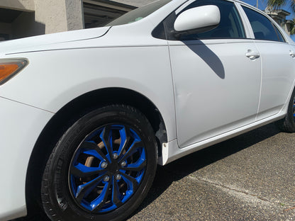 White vehicle with shiny tires after detailing, showcasing the glossy finish and well-maintained appearance.